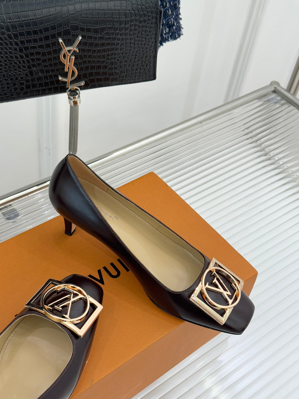 Women's dark brown square-toe block-heel pumps with gold LV logo ornament on the vamp