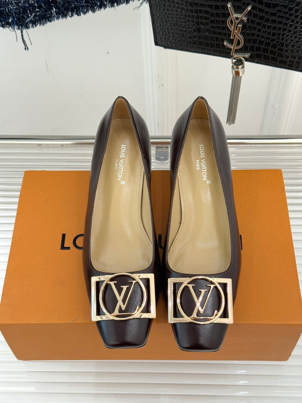 Women's square-toe block-heel pumps with gold LV logo hardware, dark brown exterior