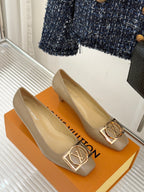 Pair of beige Louis Vuitton ladies square-toe pumps with gold LV logo buckle