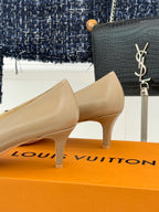 Beige Louis Vuitton ladies heeled pumps with gold LV logo buckle at front