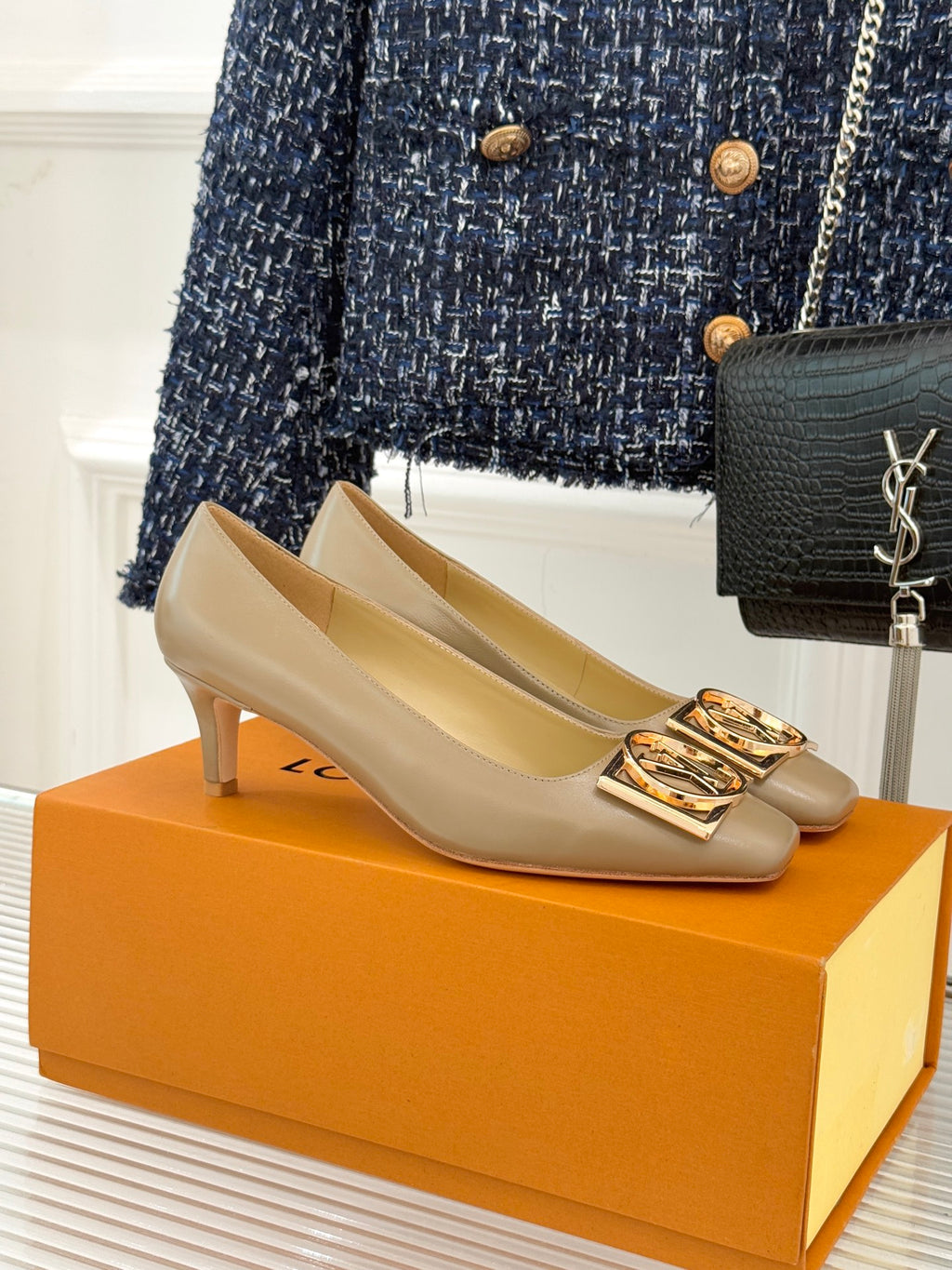 Beige Louis Vuitton ladies square-toe pumps with gold LV logo buckle detail