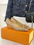 Beige Louis Vuitton ladies square-toe pumps with gold LV logo buckle detail