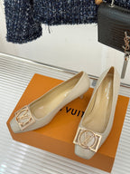 Cream Louis Vuitton pumps, pointed toe, gold square logo buckles
