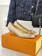 Louis Vuitton ladies cream pumps with gold square logo buckles