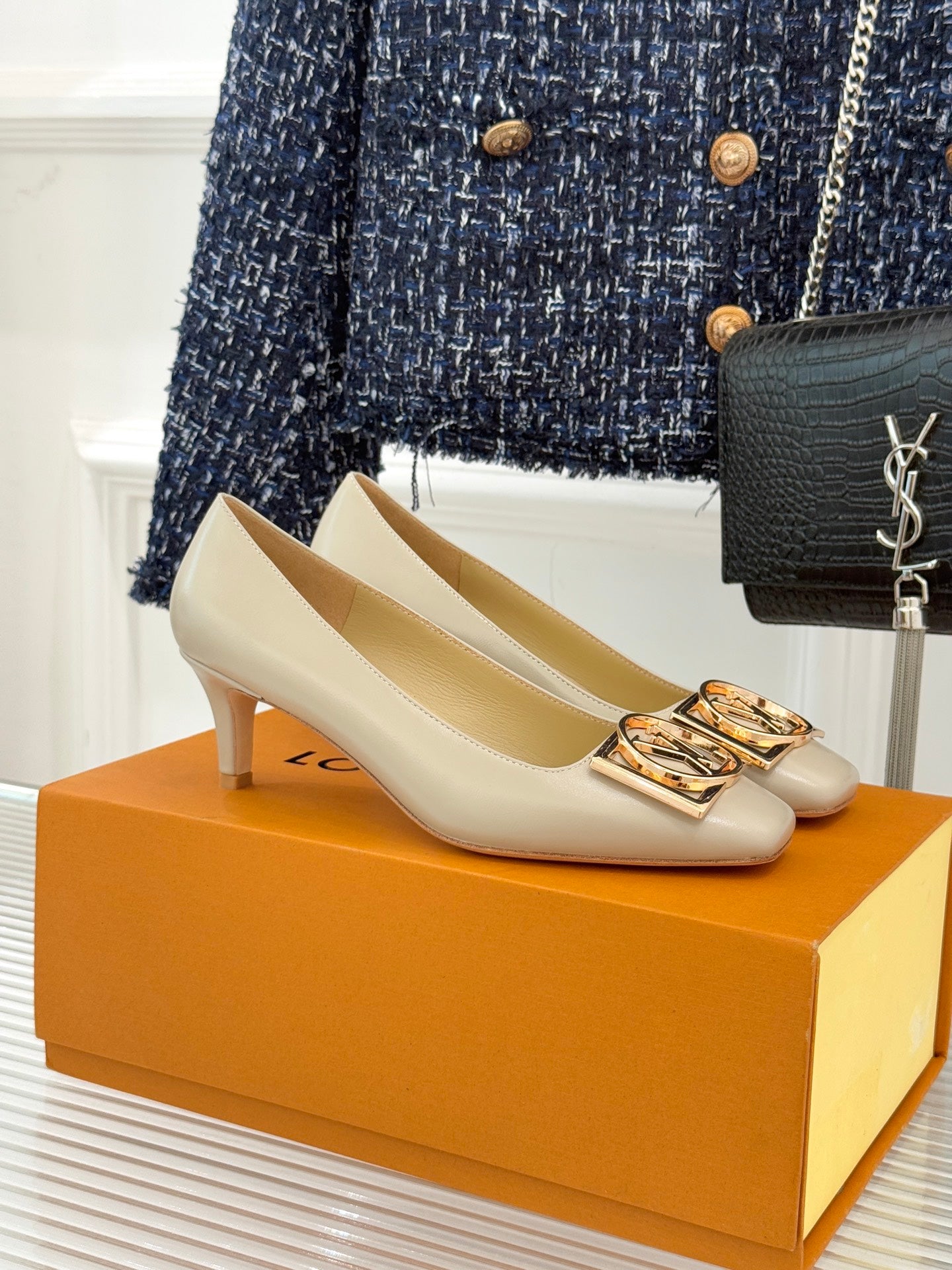 Louis Vuitton ladies cream pumps with gold square logo buckles