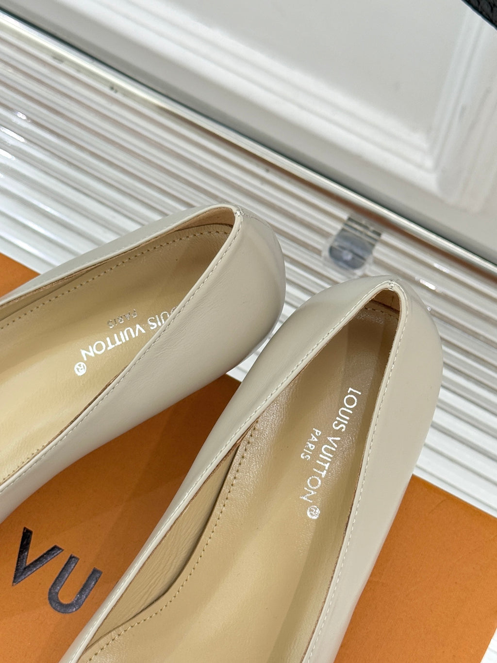 Cream Louis Vuitton pumps with logo on the inside lining