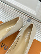 Cream Louis Vuitton pumps with logo on the inside lining