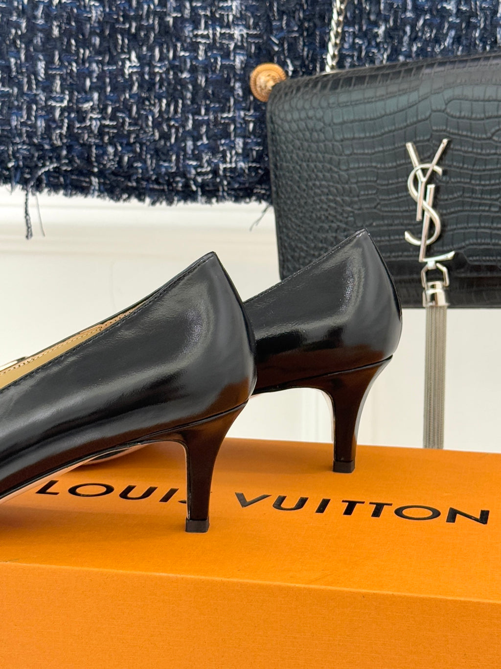 Louis Vuitton ladies black leather low-heel pumps with gold-tone logo hardware