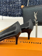 Louis Vuitton ladies black leather low-heel pumps with gold-tone logo hardware
