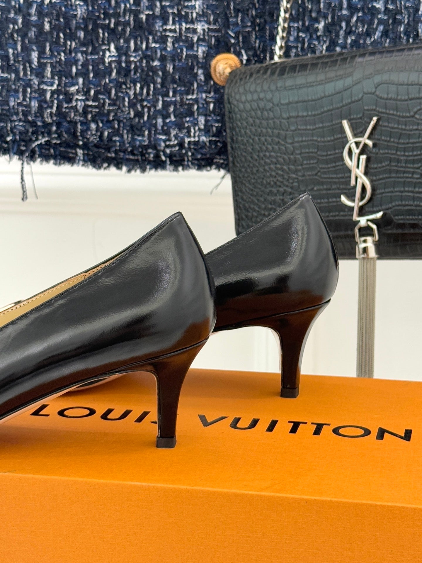 Louis Vuitton ladies black leather low-heel pumps with gold-tone logo hardware