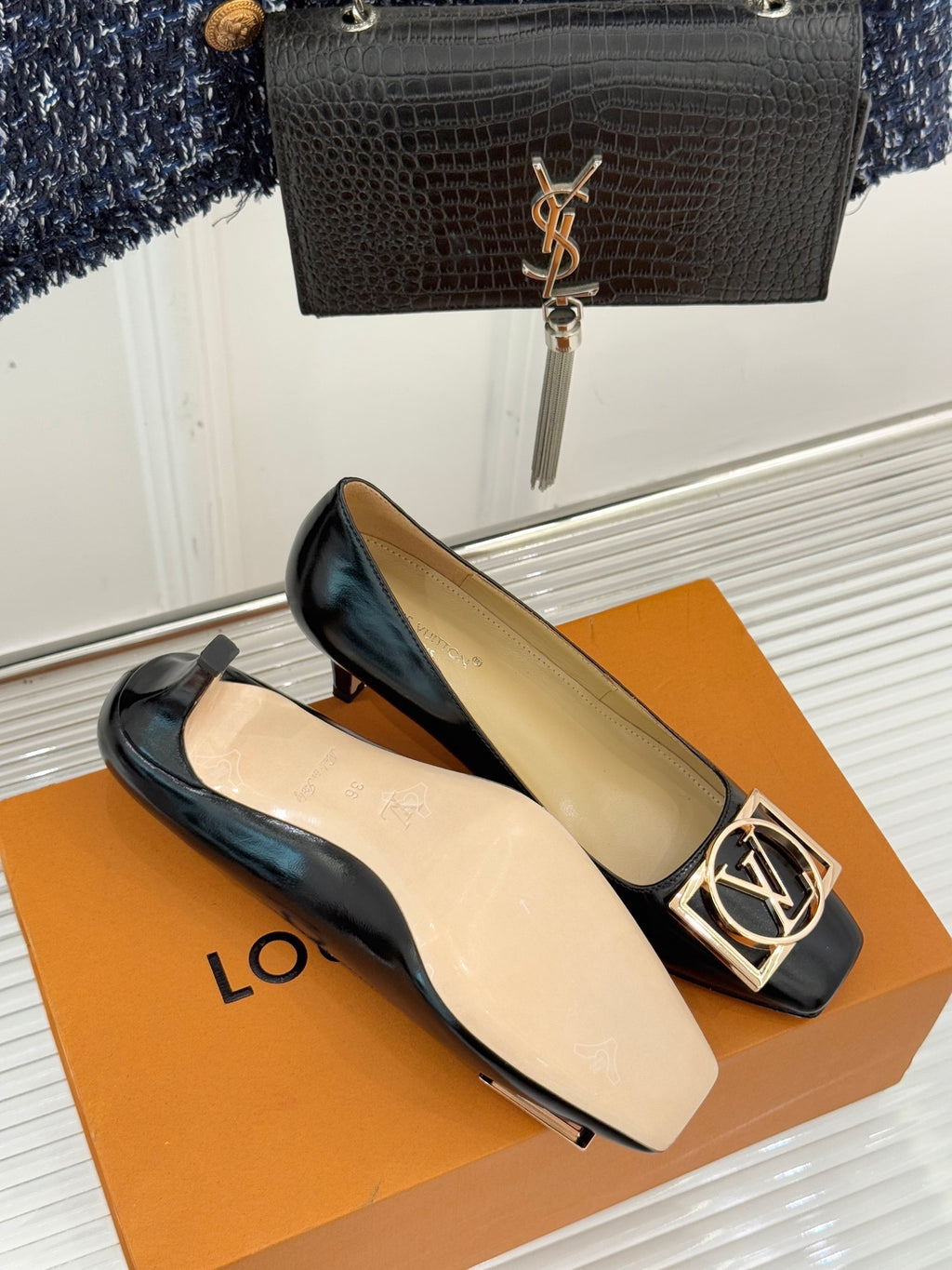 Louis Vuitton ladies black leather flats with gold square logo buckle on low heel