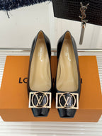Louis Vuitton ladies black flats with gold square logo buckle and beige lining