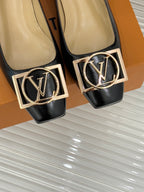 Louis Vuitton ladies black flats with close-up gold square logo buckle