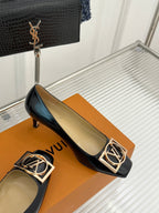 Louis Vuitton ladies black leather flats with gold square logo buckle and low heel