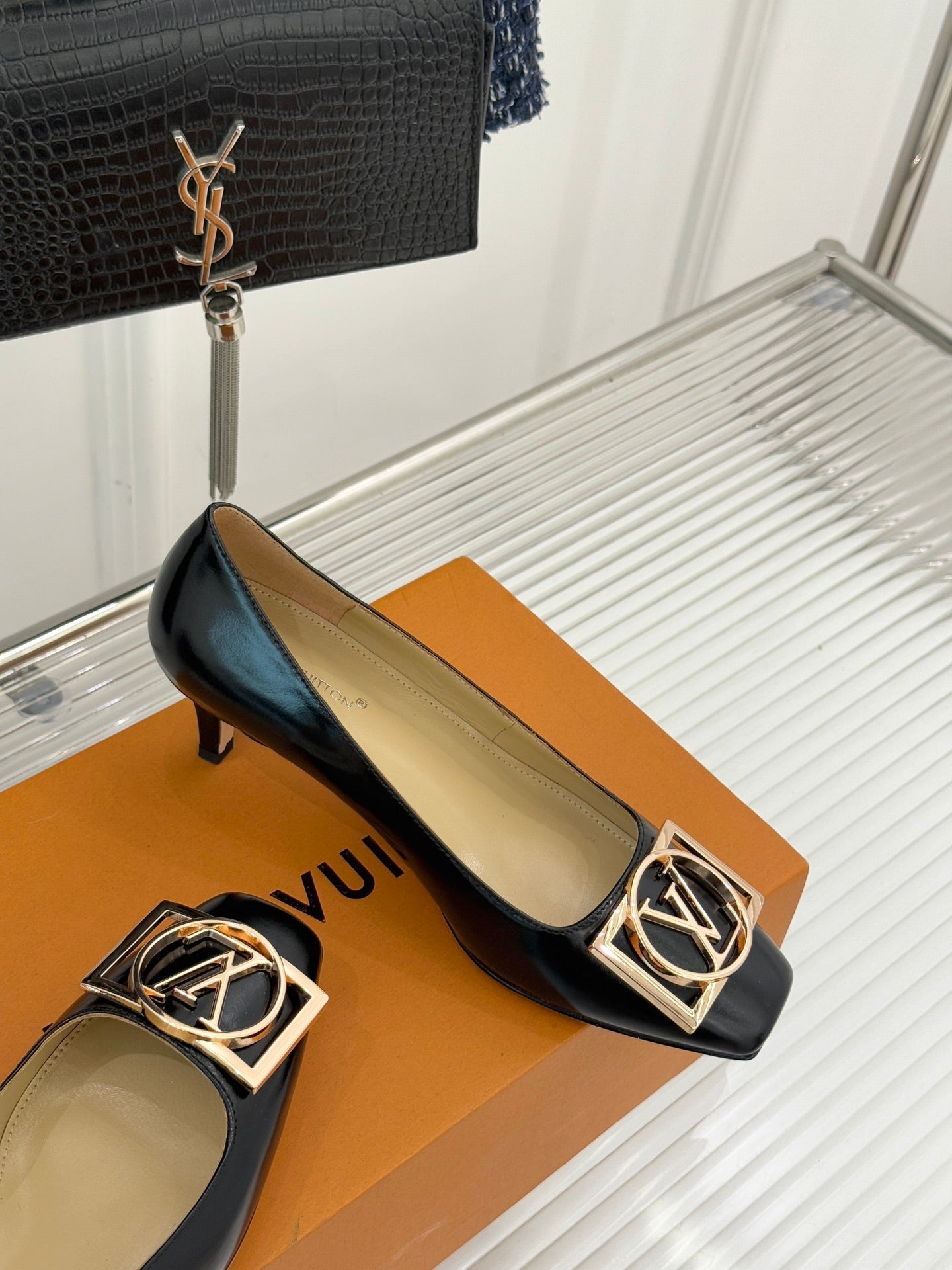 Louis Vuitton ladies black leather flats with gold square logo buckle and low heel