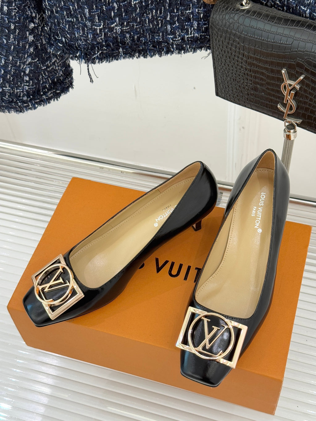 Louis Vuitton ladies black leather flats with gold square logo hardware