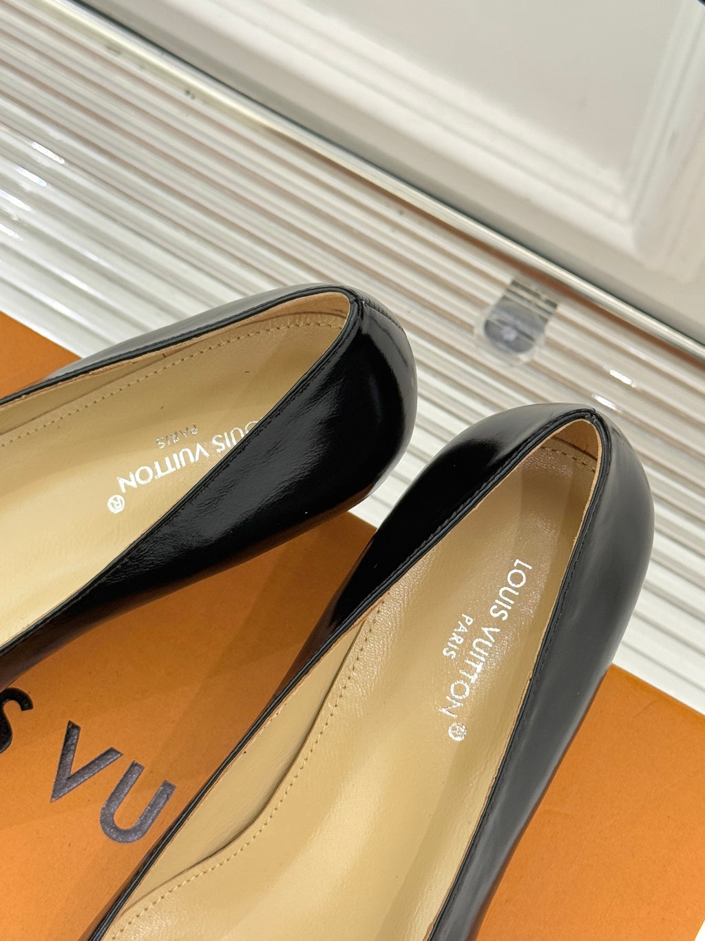 Louis Vuitton ladies black leather flats with beige interior and low heel