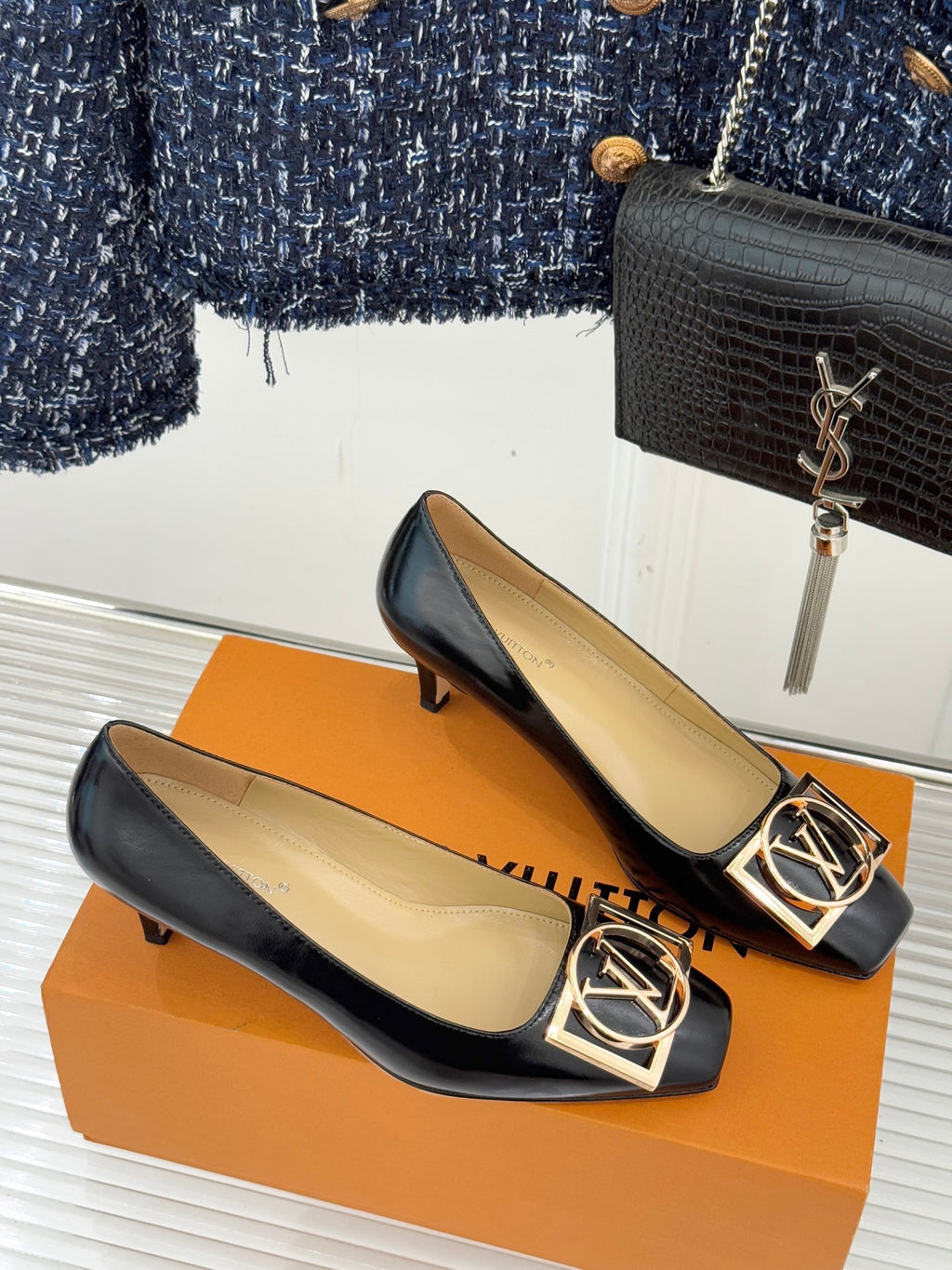 Louis Vuitton ladies black leather flats, gold square logo buckle detail