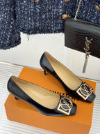 Louis Vuitton ladies black leather flats, gold square logo buckle detail