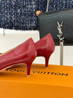 Louis Vuitton ladies red kitten-heel pumps, curved heel and glossy finish