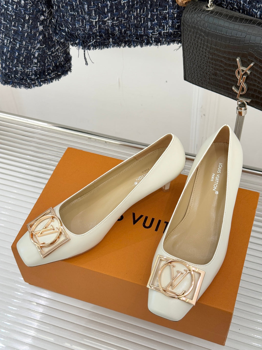 Louis Vuitton ladies’ light flats with gold-tone LV buckle, shown pair on display box