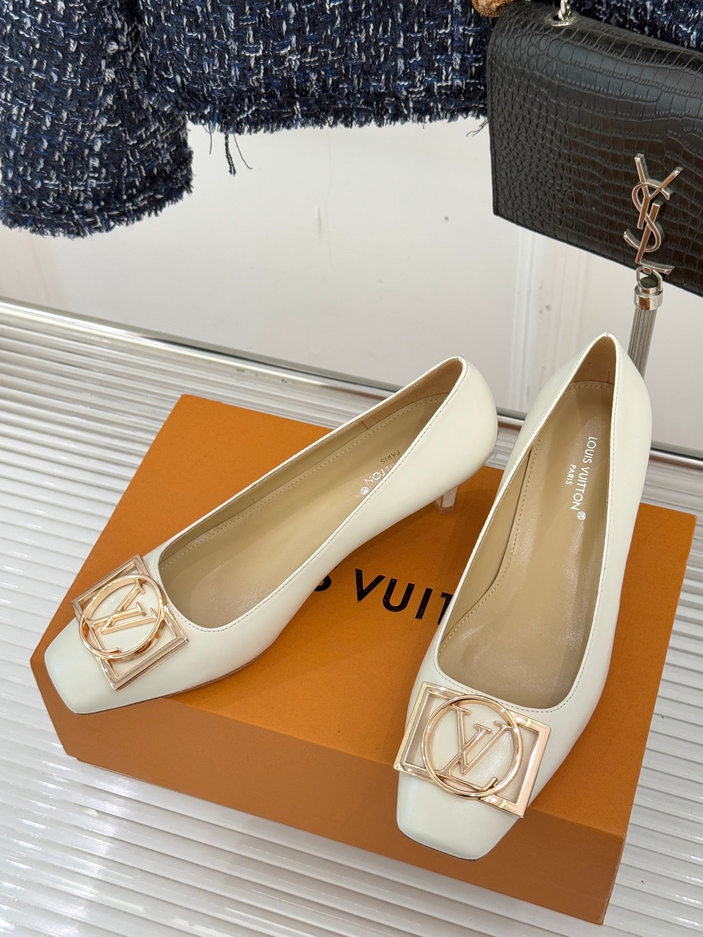 Louis Vuitton ladies’ light flats with gold-tone LV buckle, shown pair on display box