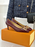 Burgundy leather low-heel pumps with gold logo square buckle detail.