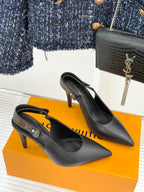 Louis Vuitton black pointed-toe heeled pumps from side and front angle