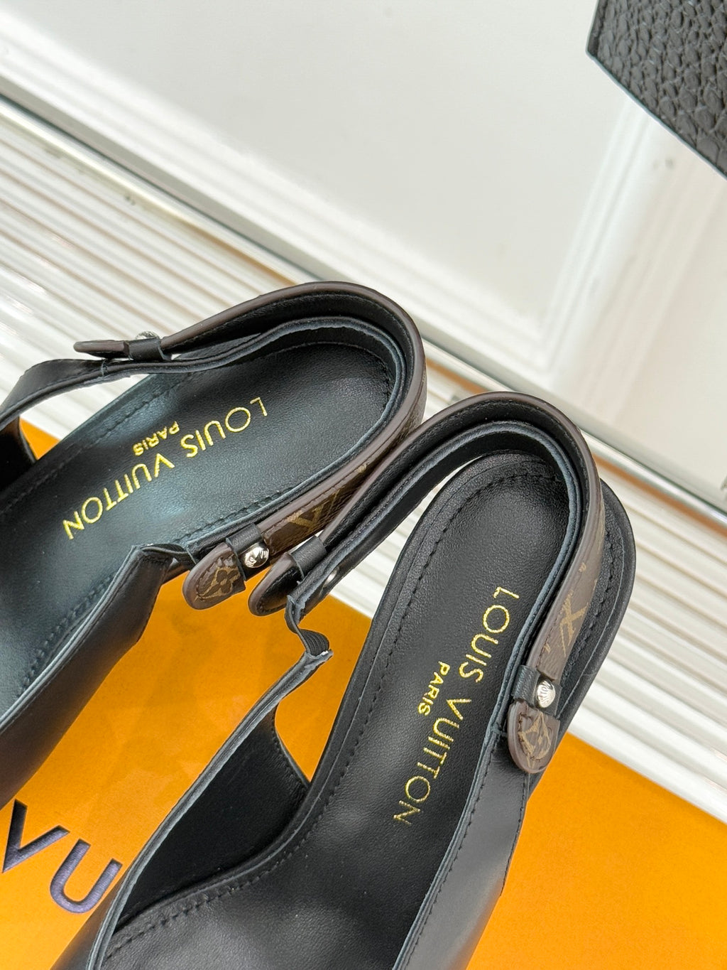 Louis Vuitton black pointed-toe heeled pumps, inner side close-up
