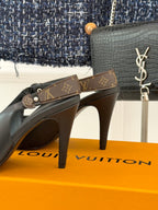 Louis Vuitton black pointed-toe heeled pumps on bright display box
