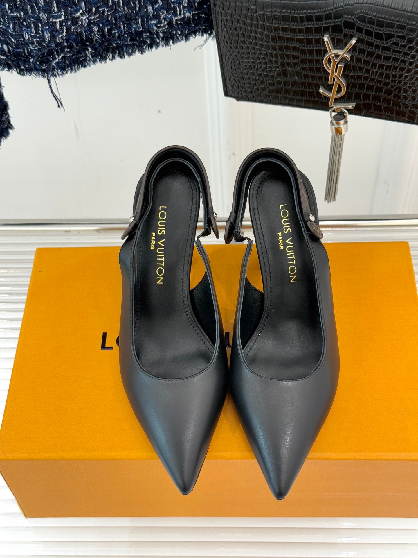 Louis Vuitton black pointed-toe heeled pumps, front view