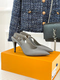 Light gray pointed-toe heeled slingback pumps with slim stiletto heel
