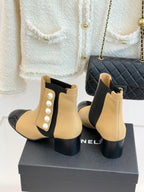 Chanel beige Chelsea boots with pearl side detailing, black elastic panels, glossy black toe