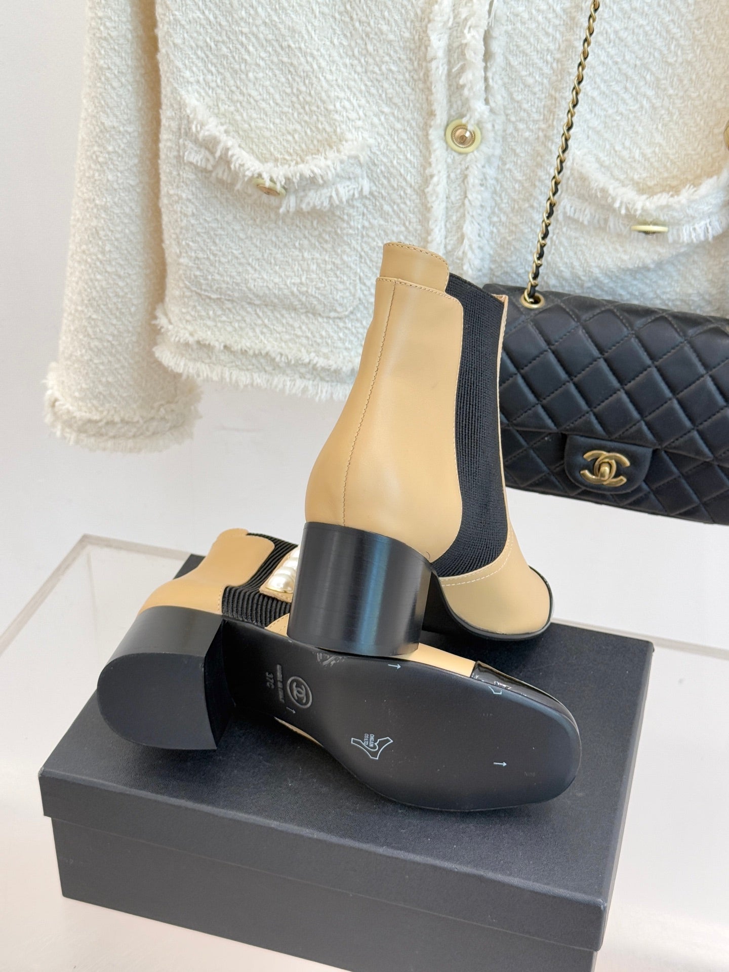 Chanel beige ankle boots with black stretch gore, pearl side accents, chunky dark heel