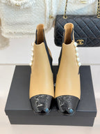 Pair of Chanel beige Chelsea boots with pearl side embellishment and black elastic gores