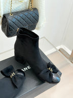 Chanel ladies ankle boots with bow detail and mid block heel, dark suede.