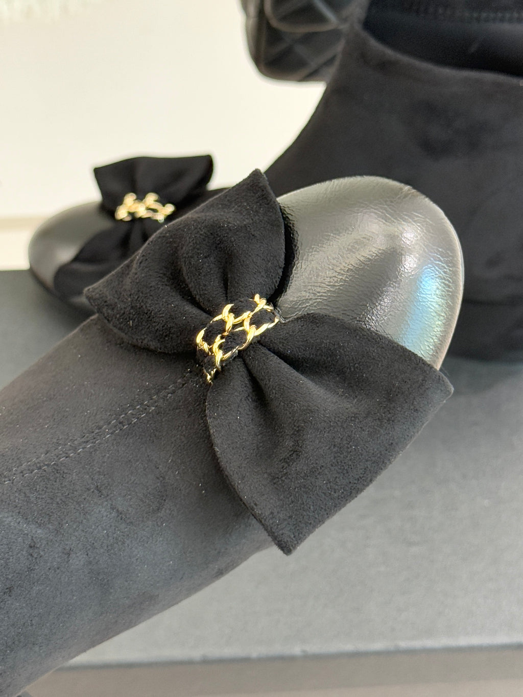 Chanel ladies ankle boot bow detail on toe with gold-tone chain clasp, dark suede.