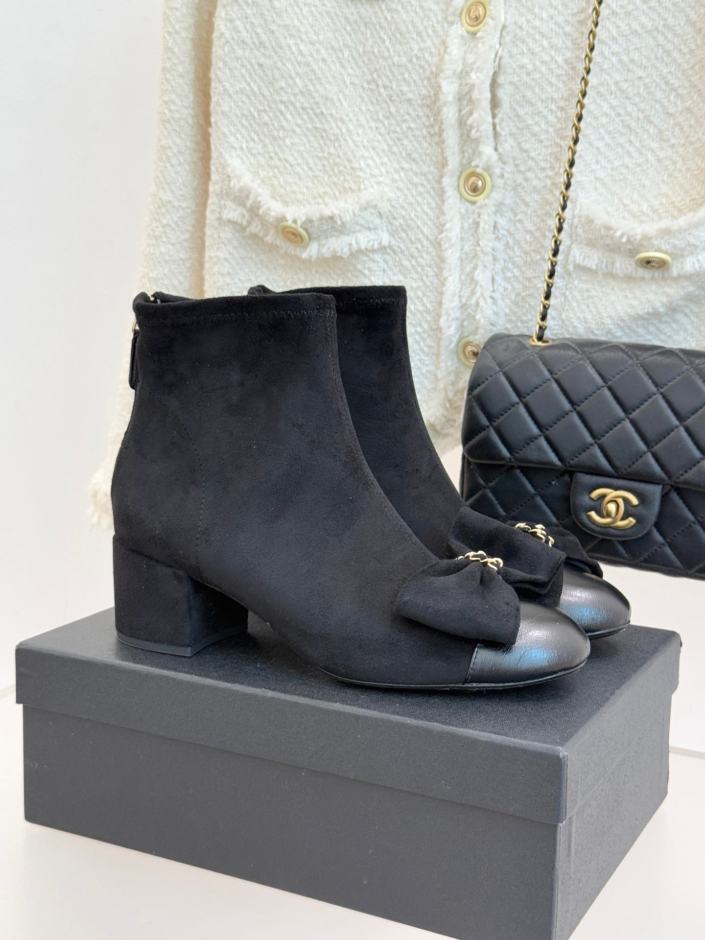 Chanel ladies suede ankle boots with bow detail and block heel, dark blue.