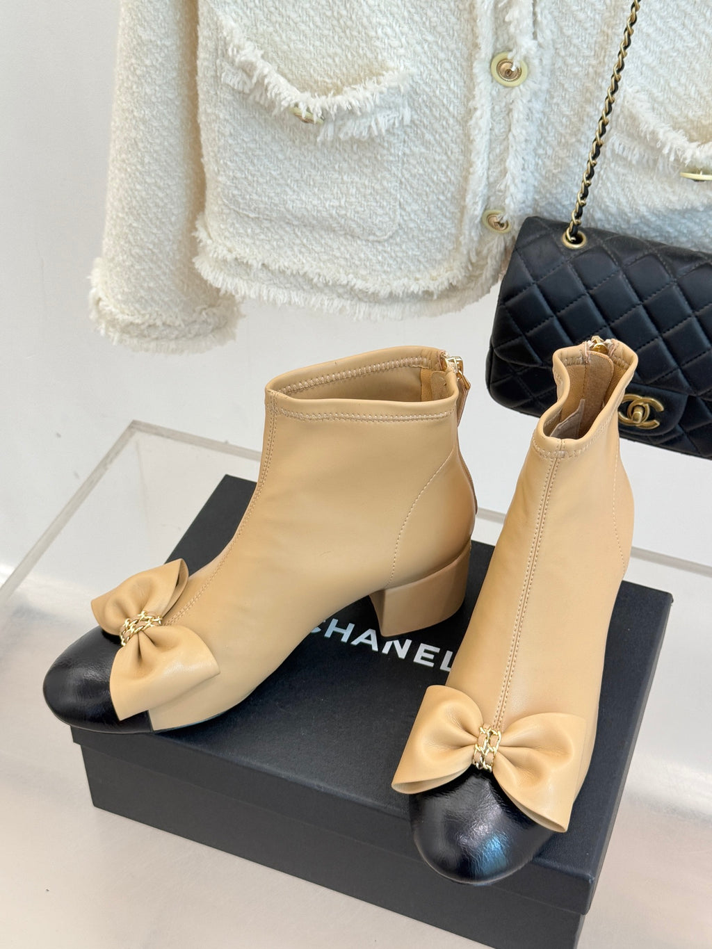 Beige leather ankle boots with bow at toe and side zipper, block heel