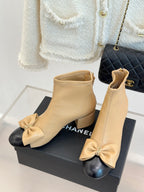 Beige leather ankle boots with bow at toe and side zipper, block heel