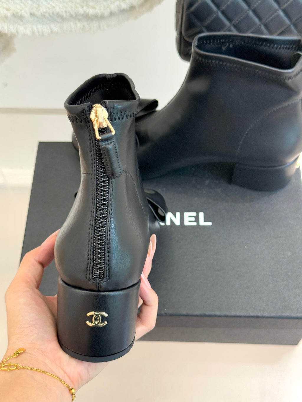 Chanel dark navy leather ankle boots with back ankle zipper and gold-tone hardware