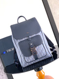 Dior backpack with blue flap, adjustable straps, and monogram jacquard front panel.