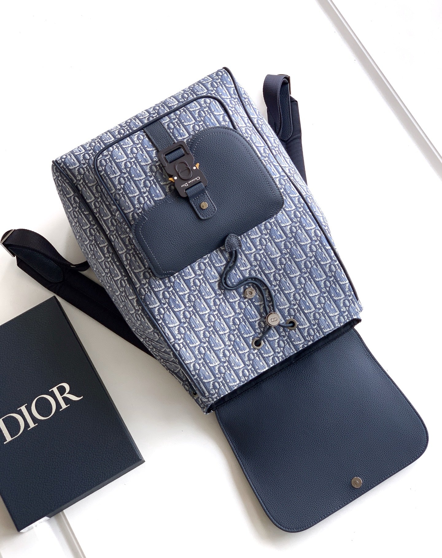 Men's Dior backpack, blue leather base with logo-print top section and front buckles
