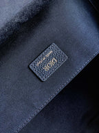 Dior men’s backpack interior close-up with stitched logo patch on dark lining