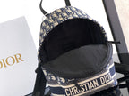 Dior mini backpack interior with black lining and blue-and-beige logo band