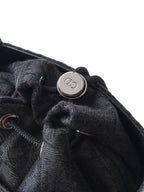 Dior logo snap detail on dark woven pouch with drawcord closure