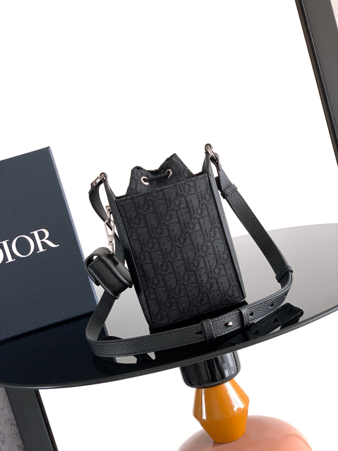 Men's Dior crossbody bag, dark monogram design with wide shoulder strap and buckle