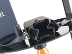 Black leather bag with top straps and adjustable shoulder strap with metal rings