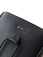 Black textured-leather bag back with embossed Dior logo