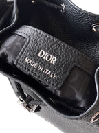 Black leather bag interior with Dior label reading Made in Italy